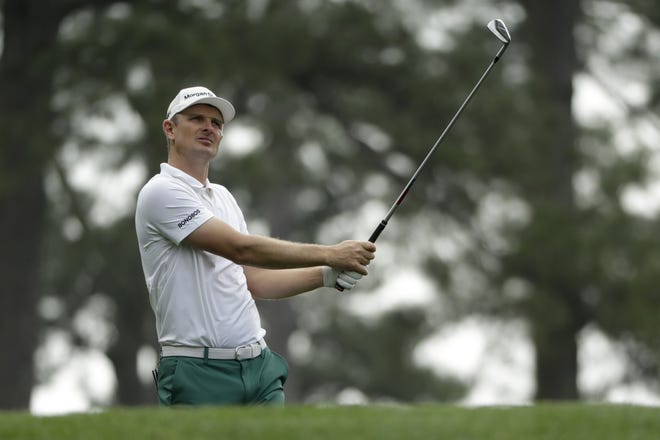 Justin Rose, of England, watches his tee shot at the seventh hole during a practice round for the Masters golf tournament Monday. (AP Photo/Marcio Jose Sanchez)