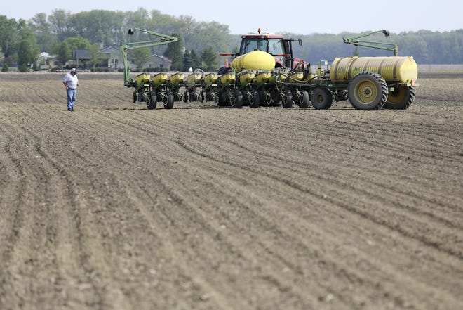 Planting corn seed on a farm North of Delaware. (Dispatch photo by Courtney Hergesheimer).