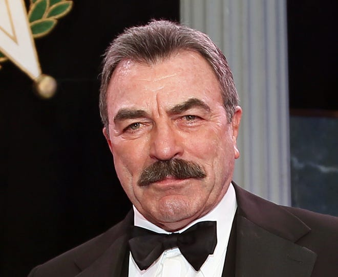 In this Nov. 16, 2017, file photo, Tom Selleck is shown during Oklahoma Hall of Fame induction ceremonies in Oklahoma City. Selleck is working on a memoir, and it won't just be about acting. The "Magnum P.I." star has a deal with Dey Street Books, an imprint of HarperCollins Publishers. The book, announced Monday, April 8, 2019, is currently untitled and does not yet have a release date. Selleck, 74, said in a statement that he would share stories about his career, but also about life "away from the camera." [AP Photo/Sue Ogrocki, File]