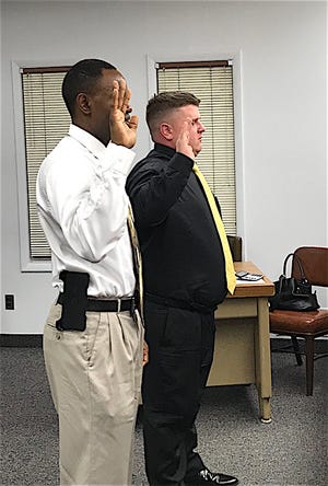 Garry D. Cotton (left) and Shawn Barauskas were sworn in as auxiliary officers of the Waynesburg Police Department during Monday’s Waynesburg Village Council meeting.