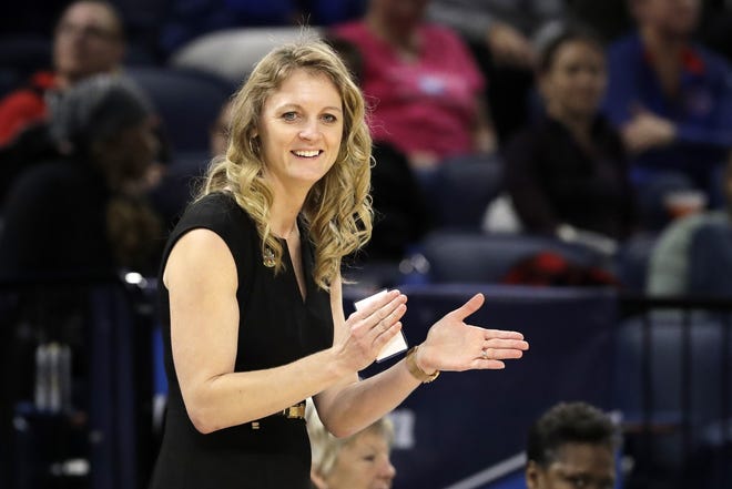 Missouri State head coach Kellie Harper smiles as he directs her team during the second half of a regional semifinal game against the Stanford in the NCAA women's college basketball tournament, Saturday, March 30, 2019, in Chicago. [Nam Y. Huh/The Associated Press]
