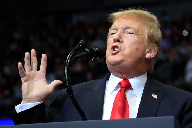 In this March 28, 2019 photo, President Donald Trump speaks at a campaign rally in Grand Rapids, Mich. Trump is suggesting he will defer until after 2020 his push for a Republican health care plan to replace the Affordable Care Act.