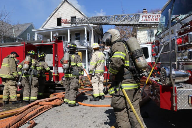 Providence firefighters battle a blaze on Sumter Street in March. [The Providence Journal, file / Sandor Bodo]