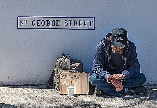 A man panhandles of St. George Street in St. Augustine in March. A recent point in time count of the county's homeless populatio counted 356 homeless individuals. Of those, 156 were living in a supervised, publicly or privately operated shelter. The other 200 were living unsheltered. [PETER WILLOTT/THE RECORD]