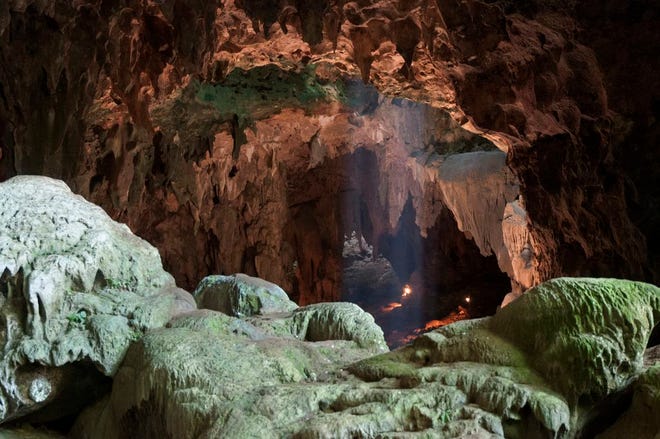 This undated photo provided by the Callao Cave Archaeology Project in April 2019 shows Callao Cave on Luzon Island of the Philippines, where the fossils of Homo luzonensis were discovered. This view is taken from the rear of the first chamber of the cave, where the fossils were found, in the direction of the second chamber. In a study released on Thursday, April 10, 2019, scientists report that tests on two samples from the species show minimum ages of 50,000 years and 67,000 years.