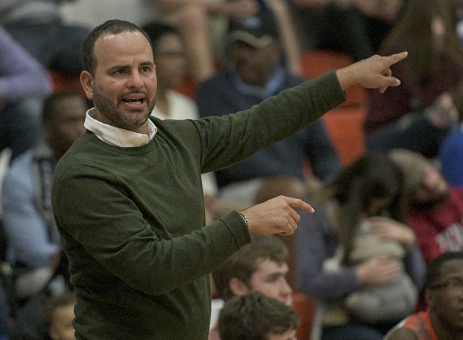 Mount Dora coach Ariel Betancourt signals to his players during a game in Mount Dora on Jan. 29. Betancourt stepped down after nine seasons leading the Hurricanes. [PAUL RYAN / CORRESPONDENT]