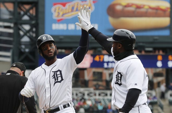 Detroit Tigers' Niko Goodrum, left, is greeted by Christin Stewart after hitting a two-run home run which scored Goodrum and Miguel Cabrera during the first inning of a baseball game against the Cleveland Indians, Wednesday, April 10, 2019, in Detroit. (AP Photo/Carlos Osorio)