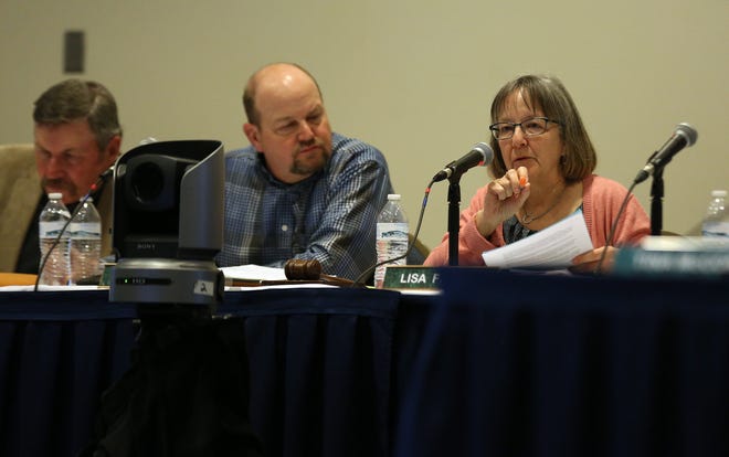 Reno County Planning Commission member Lisa French asks questions of NextEra officials with commission members Ken Jorns, left, and Russ Goertzen, center, during the public hearing Thursday evening at the Atrium Hotel. 

The public comment portion of the hearing ended Wednesday. NextEra officials now will be offered 90 minutes for rebuttal. [Sandra J. Milburn/HutchNews]