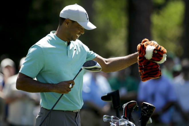 Tiger Woods pulls out his driver on the seventh hole during a practice round for the Masters golf tournament Wednesday, April 10, 2019, in Augusta, Ga. (AP Photo/Charlie Riedel)