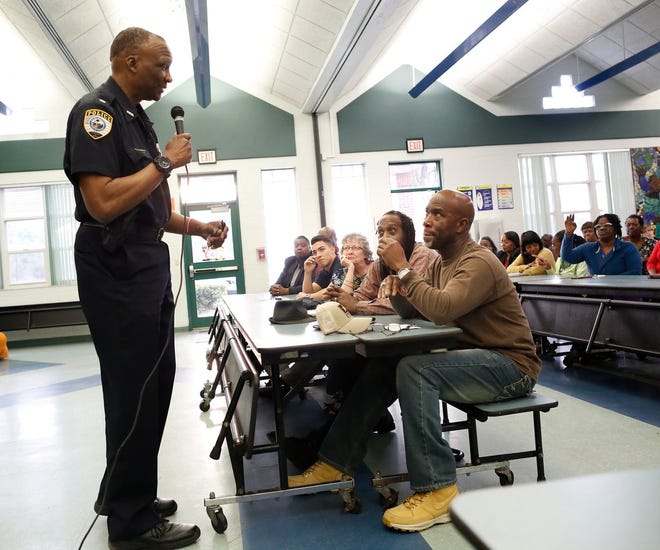 Gainesville Police Chief Tony Jones answers questions from a group of citizens about issues in the Duval neighborhood during a community meeting held at the Duval Early Learning Academy on March 20. [Brad McClenny/The Gainesville Sun]