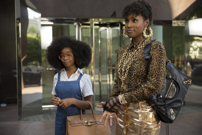 This image released by Universal Pictures shows Marsai Martin, left, and Issa Rae in a scene from "Little." (Universal Pictures via AP)