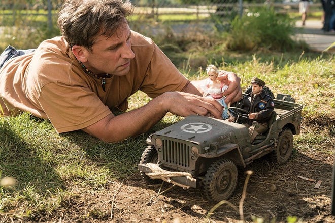 Steve Carell as Mark Hogancamp photographs the dolls for his fictional town in "Welcome to Marwen," directed by Robert Zemeckis. [Contributed by Ed Araquel/Universal Pictures and DreamWorks Pictures]