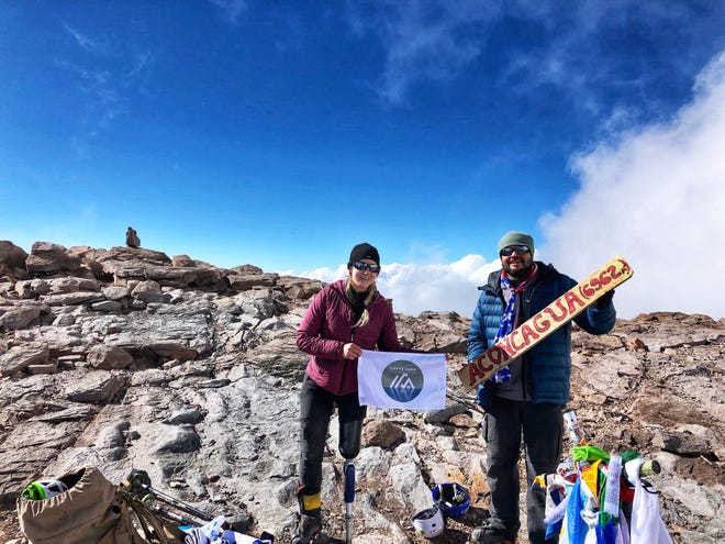 Kirstie Ennis makes it to the summit of Aconcagua in Argentina (22,841 feet) with one of her climbing companions, fellow veteran David Rendon. [CONTRIBUTED PHOTO]