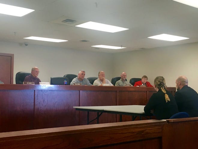 Ionia County Prosecutor Kyle Butler and Assistant Prosecuting Attorney Erica Parker speak with the Ionia County Board of Commissioners on Tuesday, April 9. Parker is leaving Ionia County for a similar, higher paying position in Livingston County. [MITCHELL BOATMAN/SENTINEL-STANDARD]