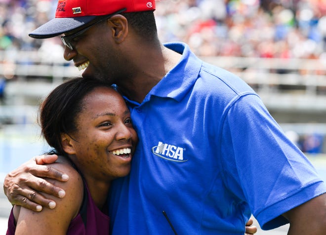 RON JOHNSON/JOURNAL STAR FILE PHOTO

Brittany Rainey of Dunlap gets a hug from her fatter, Jamero Rainey after she took second in the 100-meter high hurdles during the 2018 Class 2A IHSA girls track and field state finals in Charleston.