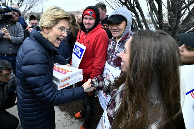 U.S. Sen. Elizabeth Warren greets striking Stop & Shop supermarket employees Friday on the picket line in Somerville. Unionized workers in three states walked off the job on Thursday over stalled contract negotiations. [AP Photo]