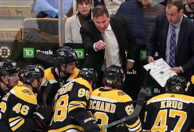 Boston Bruins coach Bruce Cassidy gestures to his players during the third period of Game 1 of an NHL hockey first-round playoff series against the Toronto Maple Leafs, Thursday, April 11, 2019, in Boston. The Leafs won 4-1. (AP Photo/Charles Krupa)
