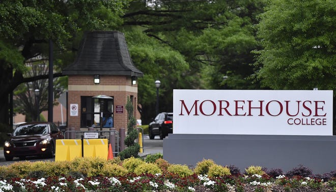 In this Friday, April 12, 2019, photo, people enter the campus of Morehouse College in Atlanta. The country's only all-male historically black college will begin admitting transgender men next year. [AP Photo/Mike Stewart]