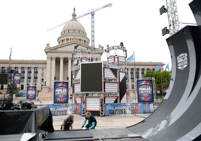 Production crews put the finishing touches on the obstacle courses on the set of NBC's "American Ninja Warrior" at the state Capitol in Oklahoma City, Friday, April 12, 2019. Photo by Sarah Phipps, The Oklahoman