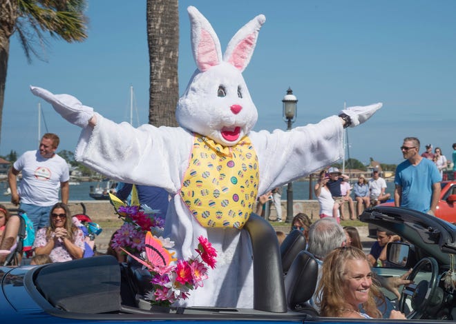 The Easter Bunny waves to the crowd from the back of a convertible car at the end of St. Augustine's annual Easter parade in this 2018 file photo. [PETER WILLOTT/THE RECORD]