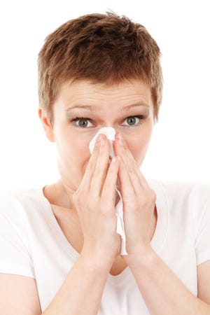 Jane Fishman hates spring, which brings lots of sneezing and the inevitable taxes. [Stock photo]