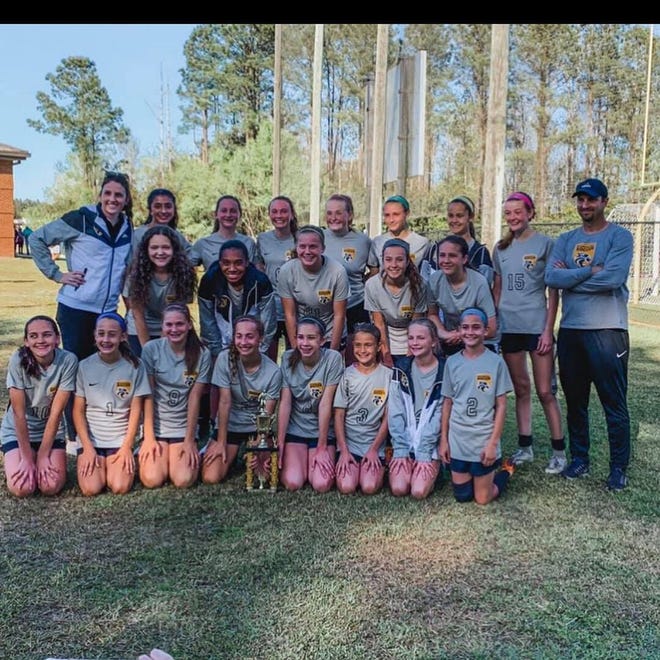 The Richmond Hill Middle School Lady Wildcats soccer team recently won its third straight Coastal Empire Region postseason tournament. [CAROLINE NIX]