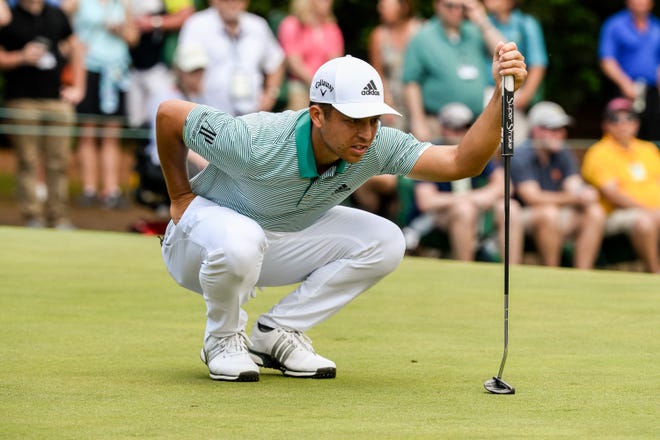 Xander Schauffele lines up a putt on No. 1 during the third round of the Masters Tournament at Augusta National Golf Club on Saturday. [ANDY NELSON/FOR THE AUGUSTA CHRONICLE]