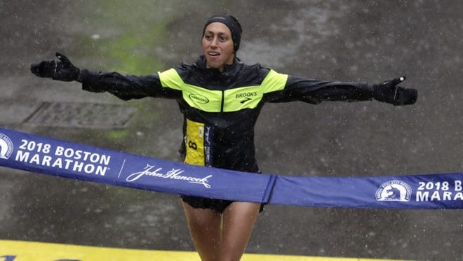 Desiree Linden crosses the finish line of the 2018 Boston Marathon to become the race's first American female winner in 33 years. [File Photo/The Associated Press]