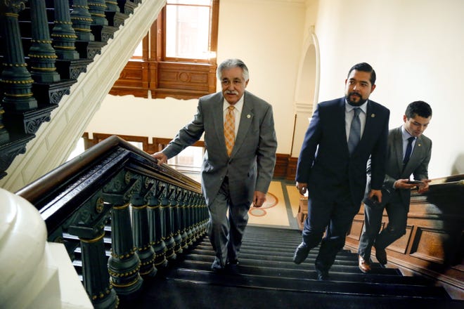 Rep. Ray Lopez, D-San Antonio, left, walks to the Texas House on Thursday with staffers Donovon Rodriguez and James Rodriguez. Lopez arrived in office last month after winning a special election. He's the 38th Hispanic member of the House, a record. [JAMES GREGG/AMERICAN-STATESMAN]