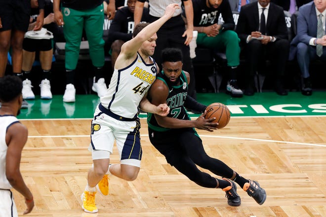 Boston Celtics' Jaylen Brown drives on Indiana Pacers' Bojan Bogdanovic during the first quarter in Game 1 of a first-round NBA basketball playoff series, Sunday, April 14, 2019, in Boston. (AP Photo/Winslow Townson)