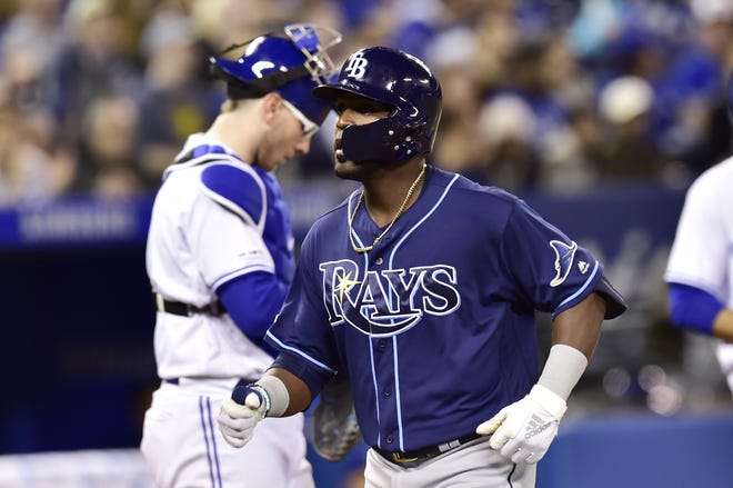Tampa Bay Rays pinch hitter Guillermo Heredia crosses the plate after hitting a solo home run during eighth inning against the Toronto Blue Jays in Toronto on Sunday. [FRANK GUNN/THE CANADIAN PRESS]