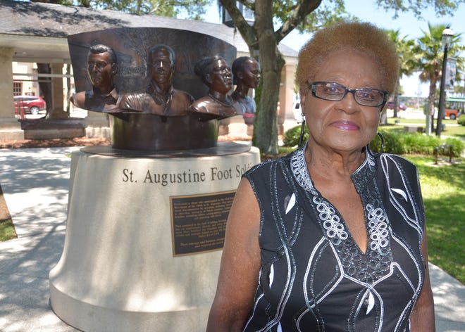 St. Augustine resident Barbara Vickers stands in front of a memorial to the men and women who took part in the civil rights protests in St. Augustine in 2014. [PETER WILLOTT/THE RECORD]