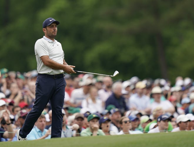 Francesco Molinari, of Italy, watches his shot go in the water on the 12th hole during the final round for the Masters golf tournament, Sunday, April 14, 2019, in Augusta, Ga. (AP Photo/David J. Phillip)