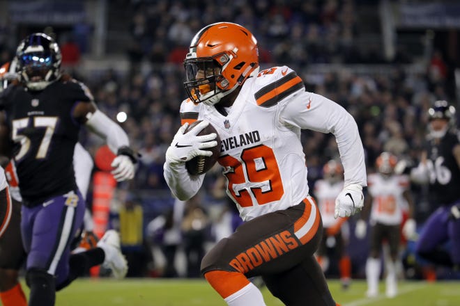 Browns running back Duke Johnson rushes the ball in the second half against the Baltimore Ravens on Dec. 30 in Baltimore. His days with the Browns may be numbered. [Carolyn Kaster/The Associated Press file photo]