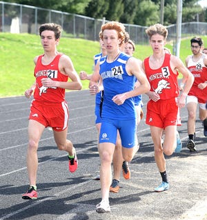 Minerva's Joey Stafford (21) and Nick Bledsoe (3) compete in the 3200 at the Big Ox Invitational. Bledsoe finished third and Stafford was fourth.