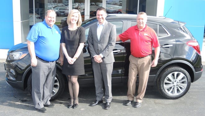 Nate Mullen of Salem was the winner of the Salem Regional Medical Center Foundation’s 2019 Buick Encore SUV raffle, donated by Stadium GM Superstore in Salem. Proceeds from the raffle for the two-year vehicle lease will be used locally to support world-class cancer care at SRMC. Mullen (second from right) is given the keys to his Buick Encore SUV by Mike Hudock, general manager, Stadium GM Superstore; Amy Reed, SRMC director of development; and Chris Tittle, inventory manager/product specialist, Stadium GM Superstore.