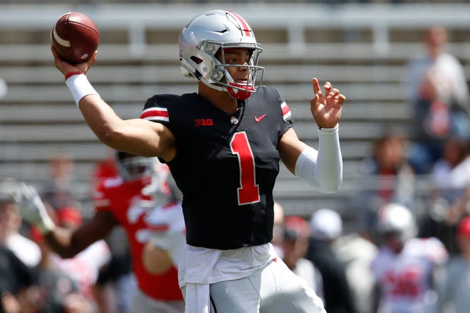 Quarterback Justin Fields throws a pass during the Ohio State spring game Saturday in Ohio Stadium. [Maddie Schroeder/For The Dispatch]