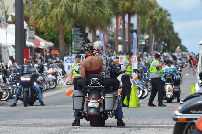 Police guide traffic and pedestrians during the 22nd Annual Leesburg Bikefest on Friday, April 27, 2018. [Whitney Lehnecker/Daily Commercial]