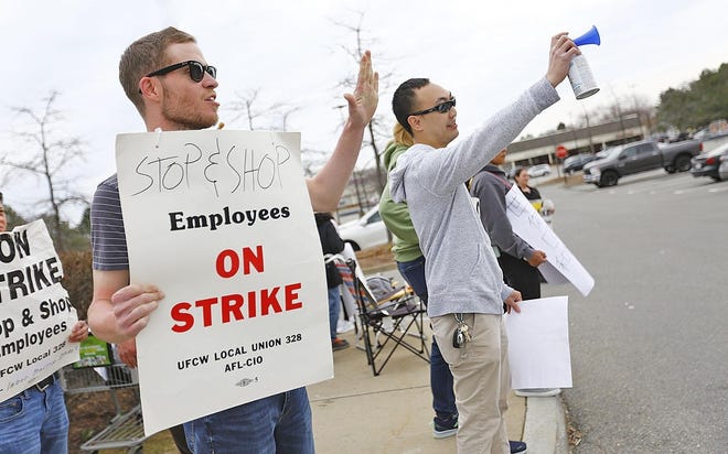 Striking Stop and Shop workers, including Brian Raftery of the deli department at left, picket at the companies North Quincy store on Newport Ave. on Sunday, April 14, 2019 (Greg Derr/The Patriot Ledger)