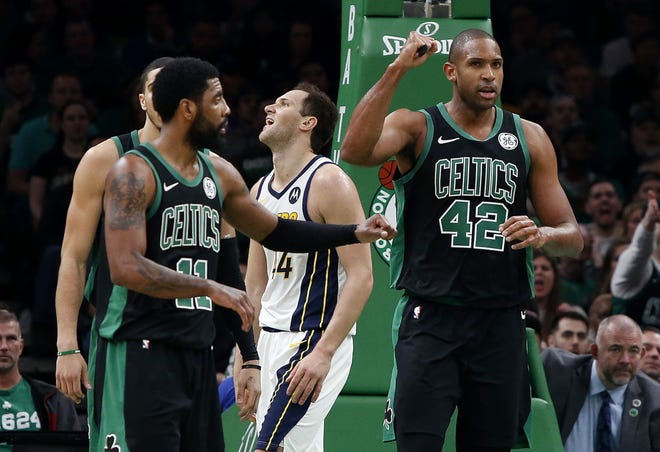 Boston Celtics' Al Horford (right) pumps his fist after being fouled while making a basket in Game 1 of the Eastern Conference Quarterfinals on Sunday. The Celtics will look to have a better shooting night in Game 2 on Wednesday. [AP Photo/Winslow Townson]