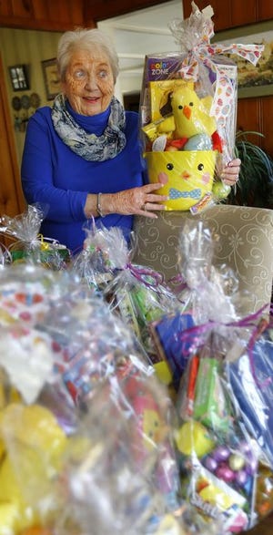 Kay Drake, 77, of Duxbury is the volunteer outreach coordinator for the Duxbury Interfaith Council. She is with "Spring Baskets" that the Girl Scouts made for children in town. Thursday, April 11, 2019