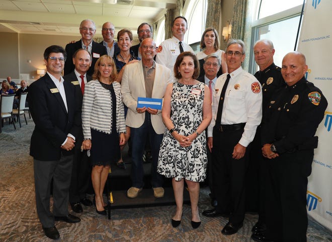The Palm Beach Gardens Police & Fire Rescue Foundation was among 24 recipients of a Mirasol Foundation grant last week. The foundation awarded more than $200,000 in grants to local nonprofits and civic organizations. [Photo by Scott Halleran]