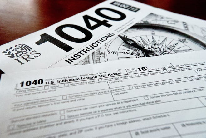 Internal Revenue Service forms are shown that are used for 2018 U.S. federal tax returns. [AP Photo/Keith Srakocic/File]