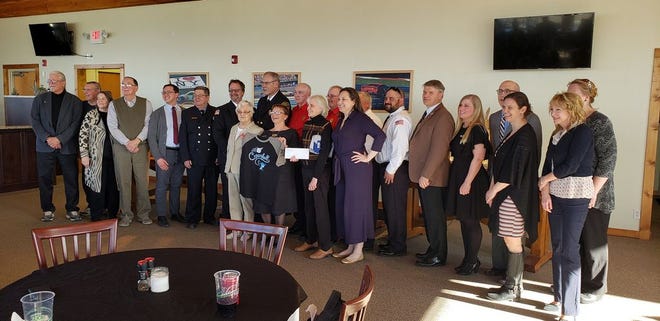 Dundee Fire Dept. representatives Ray Miller and Chief Jim Moore (back row in red) accepted the award on behalf of the Fire Department.