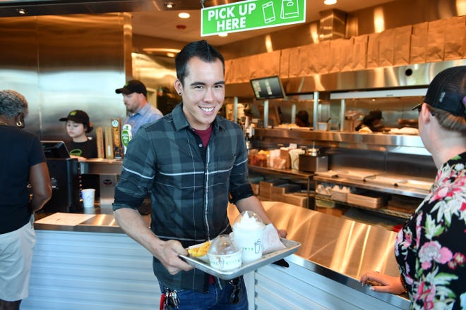 Michael Yee of Sarasota is first in line Tuesday for the grand opening of the area’s first Shake Shack at University Town Center. [Herald-Tribune staff photo / Mike Lang]
