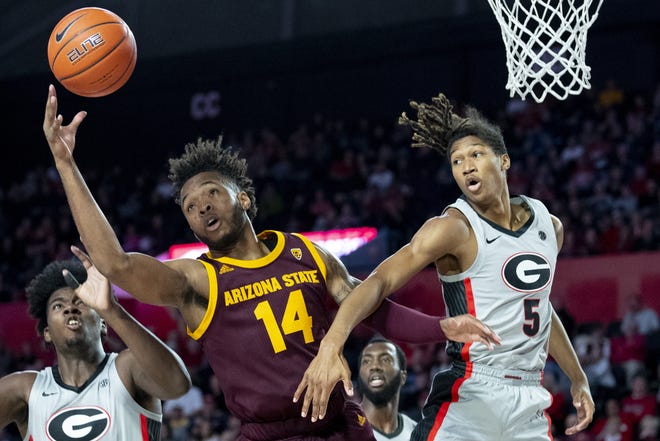 Georgia forward JoJo Toppin, right, vie for a rebound during the first half of al game against Arizona State in December. [JOHN AMIS/THE ASSOCIATED PRESS]