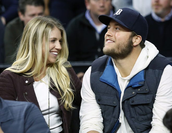 FILE - In this Nov. 17, 2015, file photo, Detroit Lions quarterback Matthew Stafford, right, smiles while watching the Detroit Pistons play the Cleveland Cavaliers with his wife Kelly, left, during an NBA game Nov. 17, 2015 in Auburn Hills, Mich. Kelly Stafford plans to have surgery to remove a brain tumor. Stafford shared the details April 3 on her Instagram account. She said an MRI showed the tumor on cranial nerves after she had vertigo spells within the last year. [DUANE BURLESON/AP FILE PHOTO]