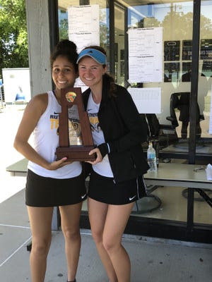 Rutherford tennis players Isabel Ceydeli and Ariane Cortes hold up a district championship trophy. The Rams' girls won the District 1-2A team title on Monday at West Florida. Ceydeli won the No. 1 singles and Cortes the No. 2 singles. They also won the No. 1 doubles title as a team. [SUBMITTED PHOTO]