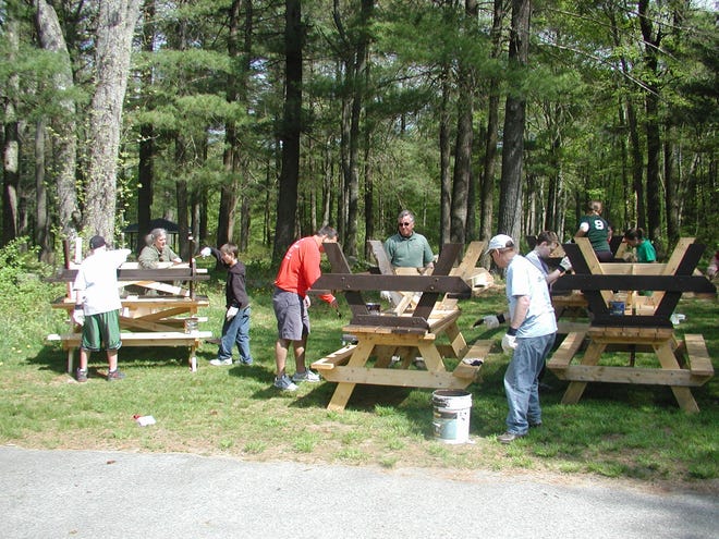 Residents participate in Park Serve Day, an initiative of the Department of Conservation and Recreation to help prepare Massachusetts parks for the spring and summer seasons. [Courtesy Photo]