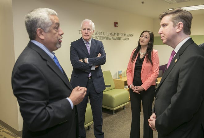 Center For Child Protection CEO Michael Torres, left, leads a tour of the facility for U.S. Sen. John Cornyn, second from left, child abuse prevention advocate Stephanie Quinn-Hrabal, and state Rep. Tan Parker, R-Flower Mound, on Wednesday. [JAY JANNER/AMERICAN-STATESMAN]